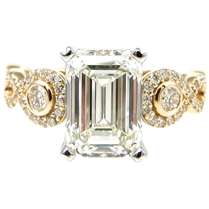 Emerald Cut Diamond Ring with Round Accents